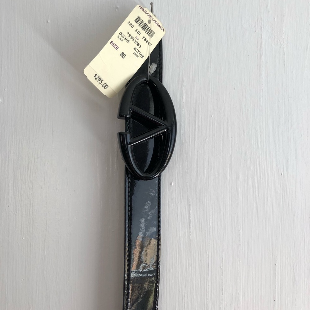 Valentino patent leather belt.